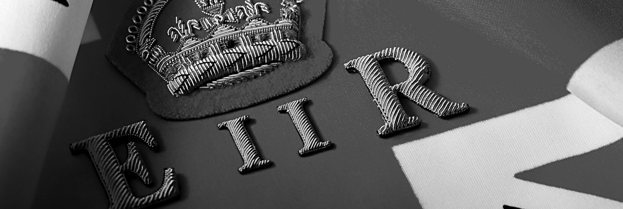 The image depicts an embossed crown above the letters "E II R" on a Union Jack flag, conveying a theme of British royalty and elegance.