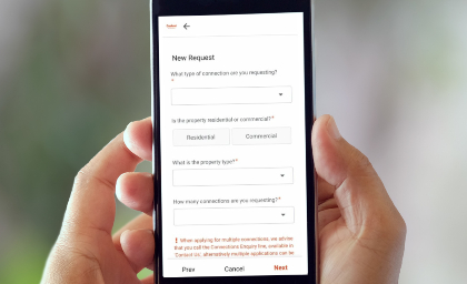 Person holding a phone with hands and filling the form.