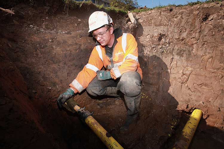Cadent engineer repairing the gas pipes underground.