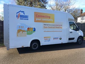 A white delivery van with branding for 