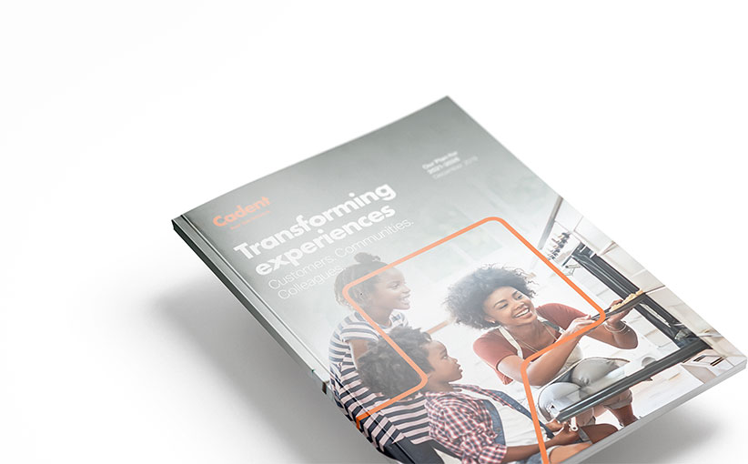 Cadent report titled 'Transforming Experiences' featuring a picture of a family in the kitchen, mother checking on food in the oven with two childen waiting eagerly on the front cover