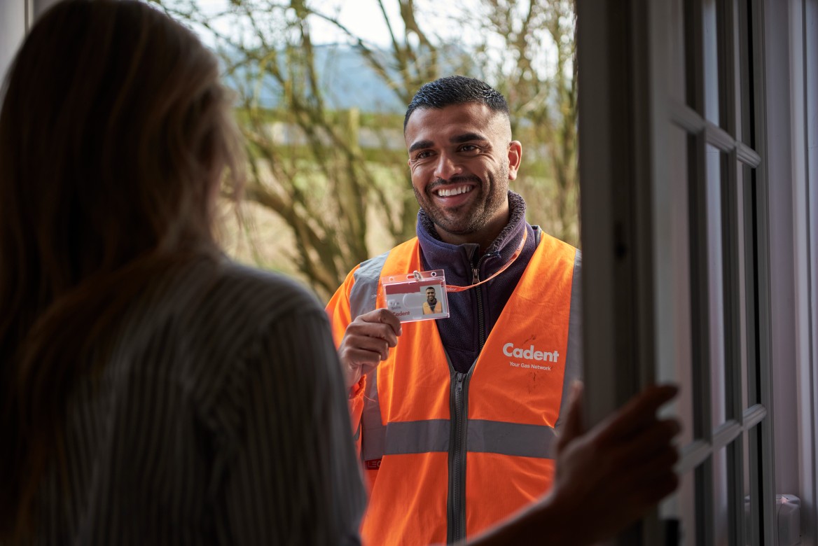 Cadent gas engineer visiting an area and showing ID at a customer's door